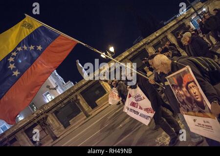 Protesters seen holding Venezuela flags and banner during the demonstration. Thousand of people demonstrated in the center of Athens against USA and showing solidarity to Venezuela. The protest ended at the US Embassy. Stock Photo