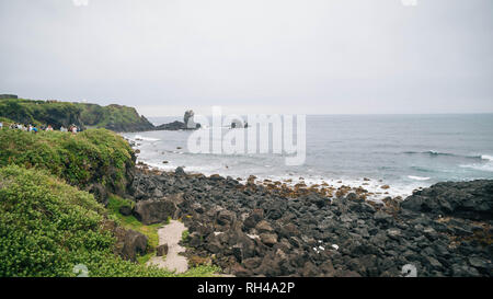 Volcanic rock beaches on the coast of Jeju Island, Seogwipo area Stock Photo