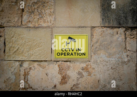 CCTV in operation sign on a exterior wall. Stock Photo