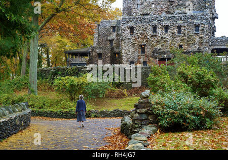 East Haddam, CT USA. Nov 2018. An elderly caretaker walking to work at the Gillette Castle in New England. Stock Photo