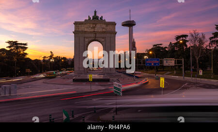 Sunset of the iconic Moncloa Arch and Faro de Moncloa in Madrid Stock Photo