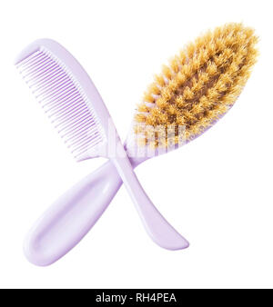 Brush and comb across isolated on white background. Kiddie-size hair brushes. Stock Photo