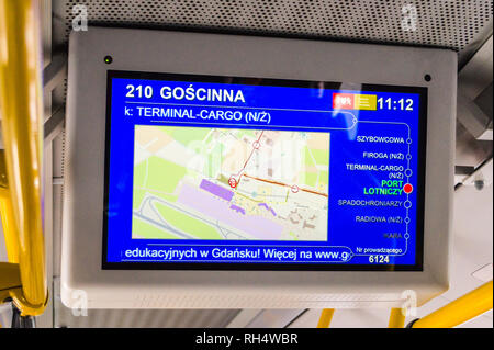 Electronic destination board and passengers on a city bus, Gdańsk, Poland Stock Photo