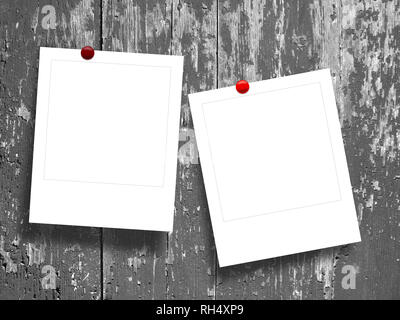 Two blank square instant photo frames against gray scratched wooden boards background Stock Photo