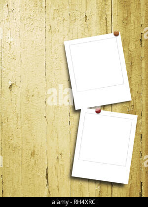 Two blank square instant photo frames against yellow scratched wooden boards background Stock Photo