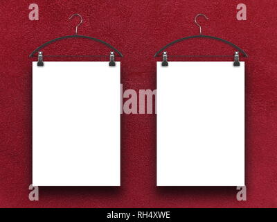 Two blank frames against red plaster wall background Stock Photo