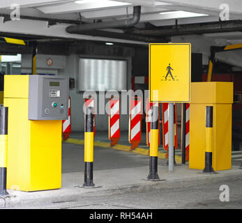 Automated ticket machine at underground parking garage Stock Photo