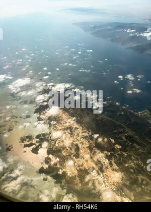 Landscape view from a window of a plane while in flight over Izmir city Turkey.