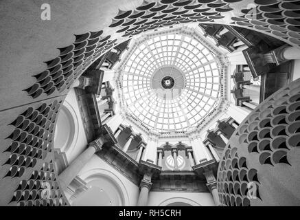 Detailed view of the spiral staircase at Tate Britain art gallery, with domed ceiling above. Photographed in monochrome. Stock Photo