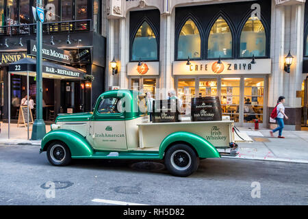 Classic Green and White Chevrolet 3100 pickup truck of 'IrishAmerican' company, parked in library way, New York C Stock Photo