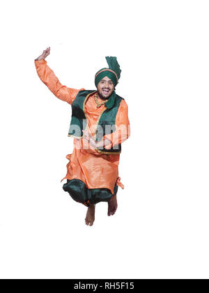 PORTRAIT OF A BHANGRA DANCER JUMPING UP Stock Photo
