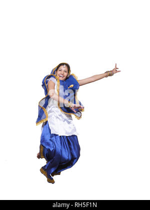 PORTRAIT OF A SARDARNI, SIKH WOMAN JUMPING DANCING THE BHANGRA Stock Photo