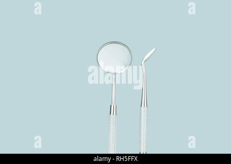 Professional dentist tools: dentist mirror, forceps curved, explorer curved Stock Photo