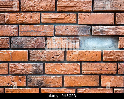Brick wall background with missing brick. Empty space from missing brick from the wall. Stock Photo