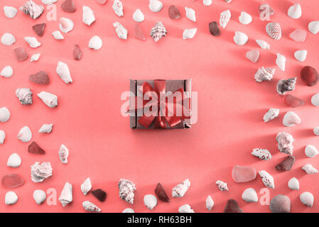 Different sea shells on live coral background. Top view flat lay Stock Photo