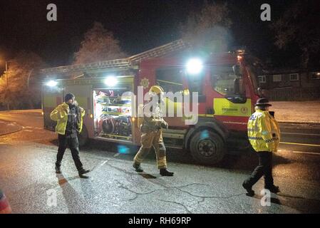 Two Police officers are seen walking on to the scene with a member of the Fire Service is seen in full respiratory system. A car caught fire tonight on the B9096 in Tullibody. Fire & Rescue and Police were on scene. There were no injuries. Fire & Rescue brought the fire under control and put it out. Stock Photo