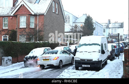 Brighton UK 1st February 2019 - Cars struggle around the side streets of Brighton  after a heavy snowfall overnight . The snow and ice has caused problems with public transport throughout the south and many schools are closed in Britain Credit: Simon Dack/Alamy Live News Stock Photo