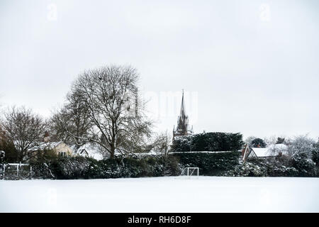 Reading, UK. 1st Feb 2019. UK Weather: Young boys play in the snow in a back garden in Reading and make a snowman. Three inches of snow fell overnight and school is cancelled for the day. Matthew Ashmore/Alamy Live News Stock Photo