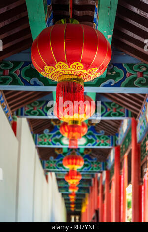 Corridor with red lanterns leading to the Jade Garden, Mu’s Residence, the mansion of the Mu family, Old Town of Lijiang, Yunnan province, China Stock Photo