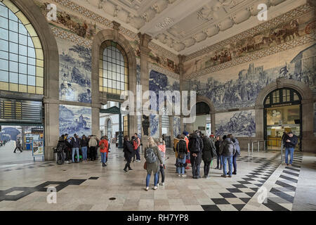 Hall of the San Bento train station decorated with blue tiles, an account of the history of Portugal in the city of Porto Stock Photo