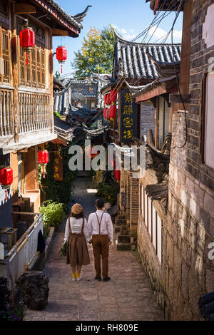 Young people dressing in traditional clothes and performing for the camera, Shuhe Ancient Town, Lijiang, Yunnan province, China Stock Photo