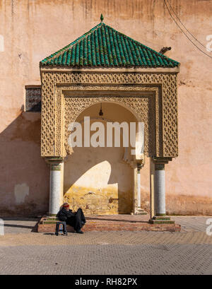 he beautiful Lahdim Place - central Square in Meknes. Sentry post with Arabesque sculpted arches in El Hedim Square's fortified wall. Morocco Miknasa Stock Photo