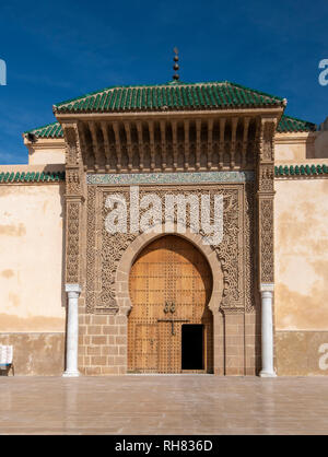 The door of The Mausoleum of Moulay Ismail in Meknes in Morocco. Mausoleum of Moulay Ismail is a tomb and mosque.  entrance gate Stock Photo