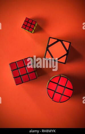collected different conundrum on red background Stock Photo - Alamy