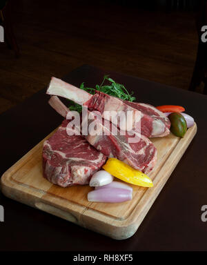 Tomahawk Steaks ready to Cook. Stock Photo