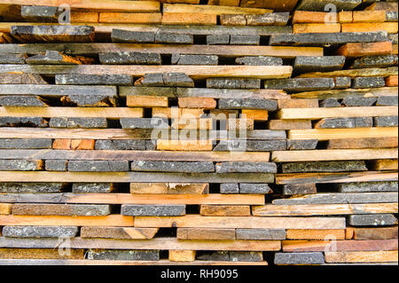A stack of boards taken at a house in Austria. Stock Photo