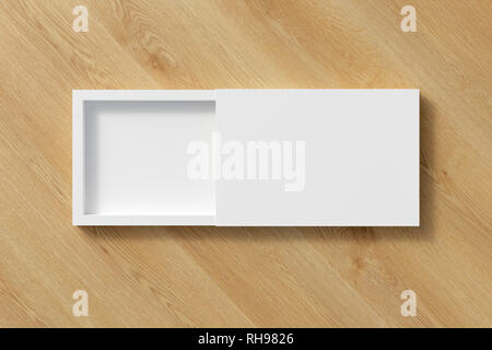 Blank opened white flat slide gift box on wooden background with clipping path around box Stock Photo