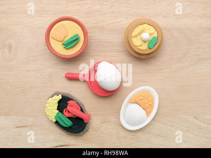 View of miniature toy food on wood background. Top view. Flat lay. Stock Photo