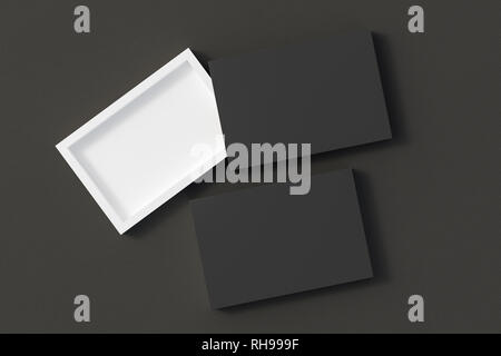 Blank opened and closed black flat slide gift box mockup on black leather background Stock Photo