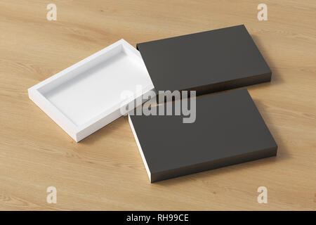 Blank opened and closed black flat slide gift box mockup on wooden background Stock Photo