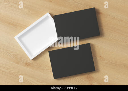 Blank opened and closed black flat slide gift box mockup on wooden background Stock Photo