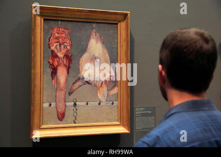 A visitor looking at Gustave Caillebotte's Calf's Head and Ox Tongue in Art Institute of Chicago. Chicago.Illinois. USA Stock Photo