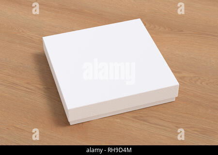 Blank white square flat gift box mock up on wooden background. With clipping path around box. Stock Photo