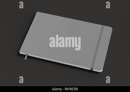 Gray horizontal notebook with elastic band on black background Stock Photo