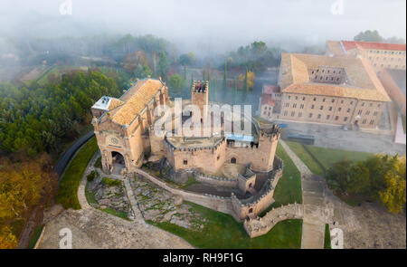 Aerial view of ancient fortified castle Castillo de Javier in foggy autumn morning, Spain Stock Photo
