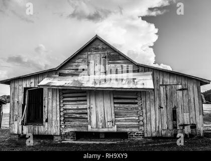 Black and white image of old corn crib barn at Windsor Castle Park in Smithfield, Virginia Stock Photo
