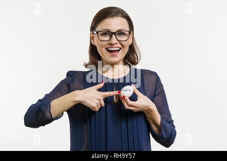 Businesswoman holds an egg in her hands with an abstract vision text. Stock Photo