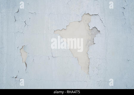 Gray peeling paint on old wall for background or texture. Stock Photo