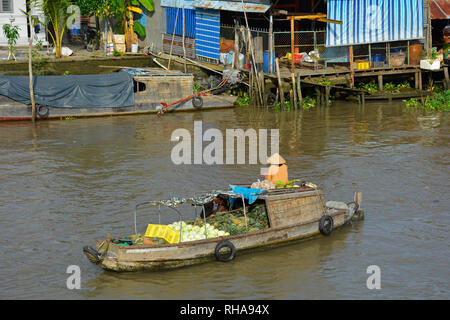 Phong Dien, Vietnam - December 31st 2017. A boat on the river at the Phong Dien Floating Market near Can Tho in the Mekong Delta Stock Photo