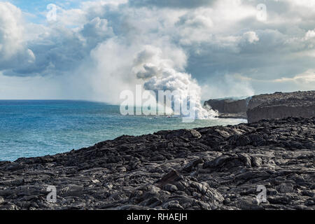 Lava of the Pu'u O'o hits the Pacific Ocean. Stock Photo