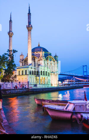 Istanbul, Turkey : Ortakoy Mosque illuminated at dusk. It was completed in 1856 by the architect Garabet Balyan in the Besiktas side of the Bosphorus  Stock Photo