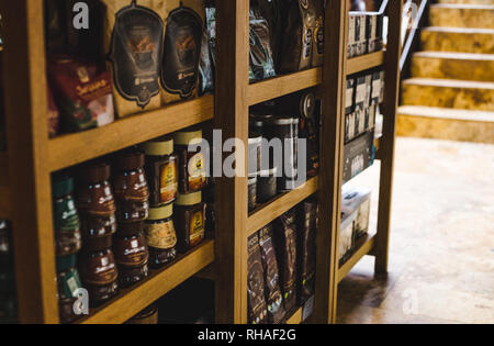 Juan Valdez coffee merchandise in a brand flagship café in Bogotá, Colombia - branded coffee, flasks and mugs Stock Photo