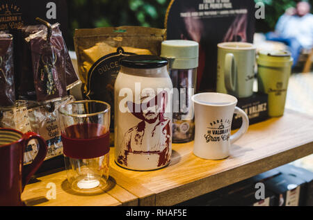 Official Juan Valdez coffee merchandise in a brand flagship café in Bogotá, Colombia - branded coffee, flasks and mugs Stock Photo