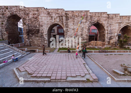Istanbul, Turkey : Street scene with people by the Aqueduct of Valens, a Roman aqueduct which was the major water-providing system of the Eastern Roma Stock Photo