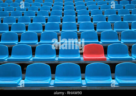 Empty seats in a stadium with one special Stock Photo