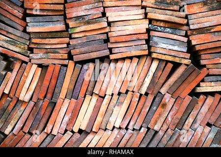 Background of old clay tiles in a pile Stock Photo